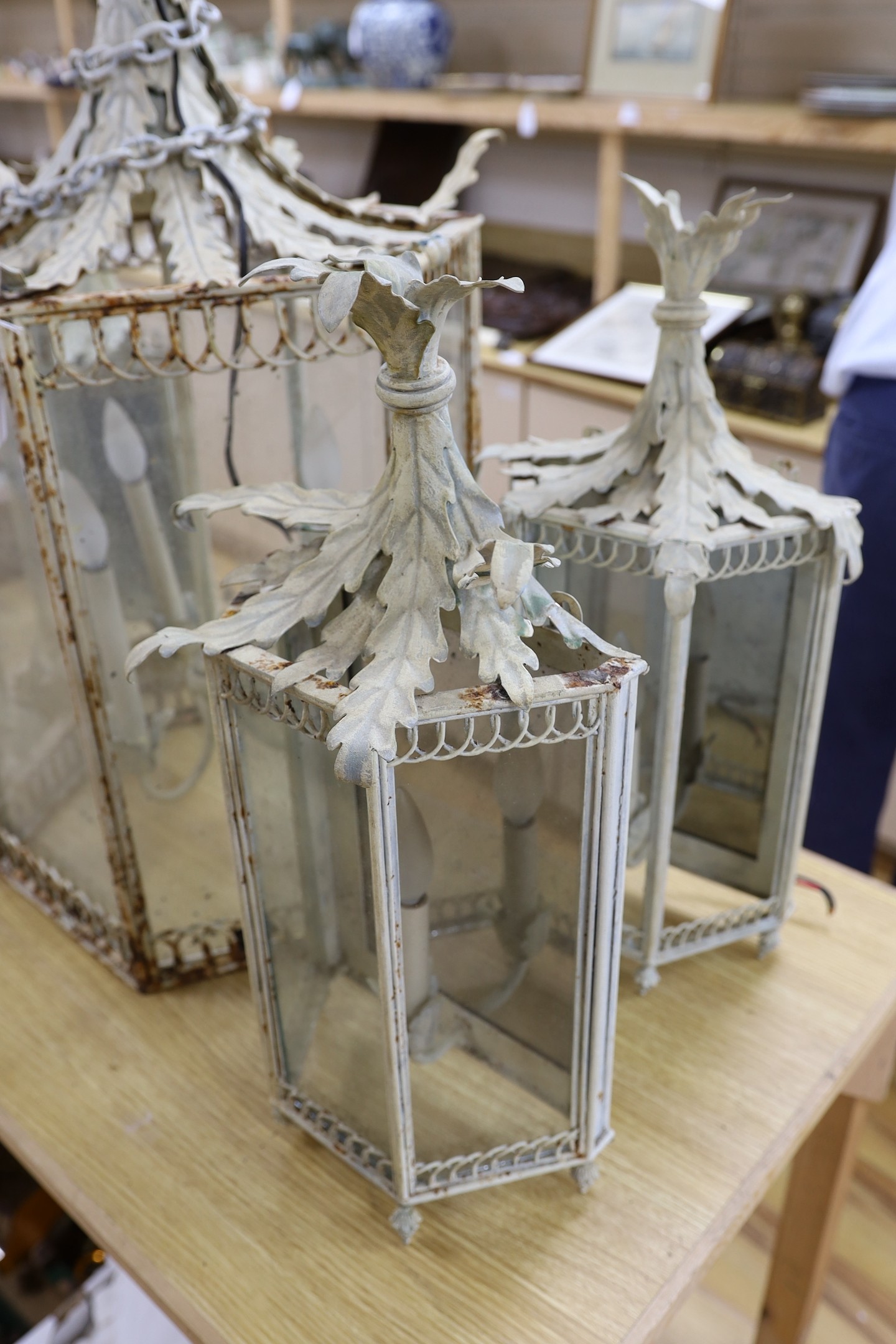 Thomas Messel - A large hexagonal painted hall lantern and a set of four matching wall lights, largest 81cm